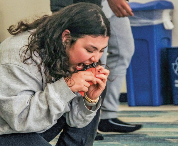 NW student Alma Dominguez playing Puss in “Puss In Boots” practices her facial expressions and movements to perfect the comedic engagement of her scenes.